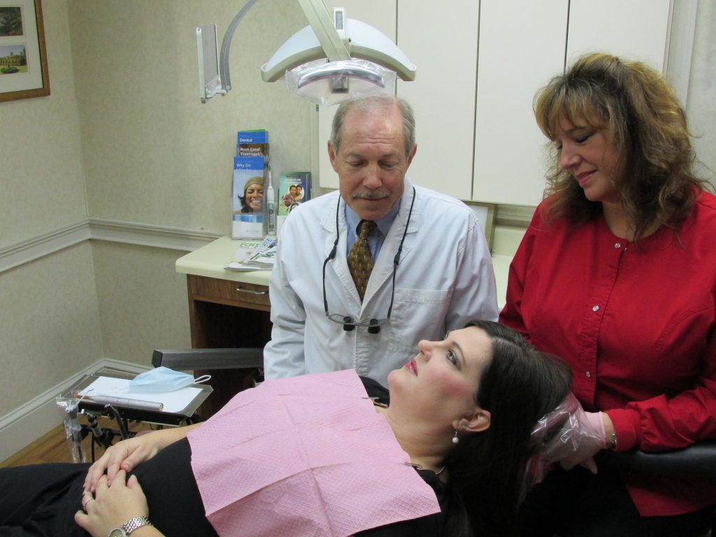 Preventative dentistry, Dr. Rice with dental hygienist and patient